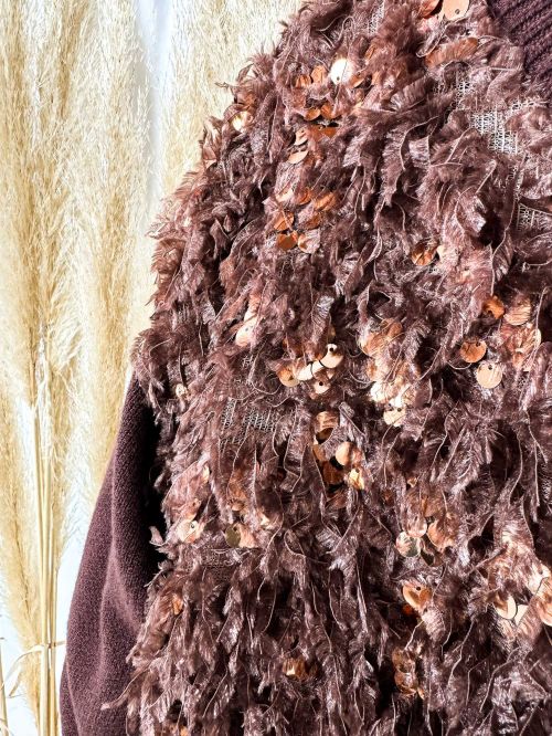 Jersey plumas y lentejuelas