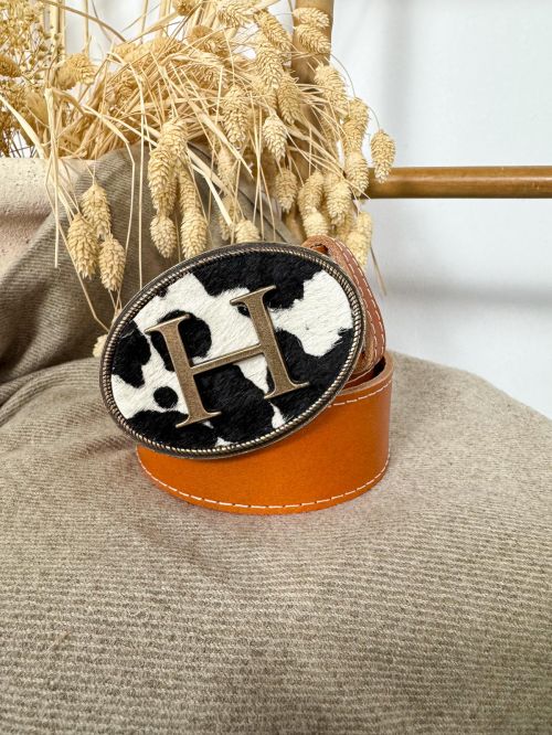 Hebilla ovalada pelo vaca inicial relieve H