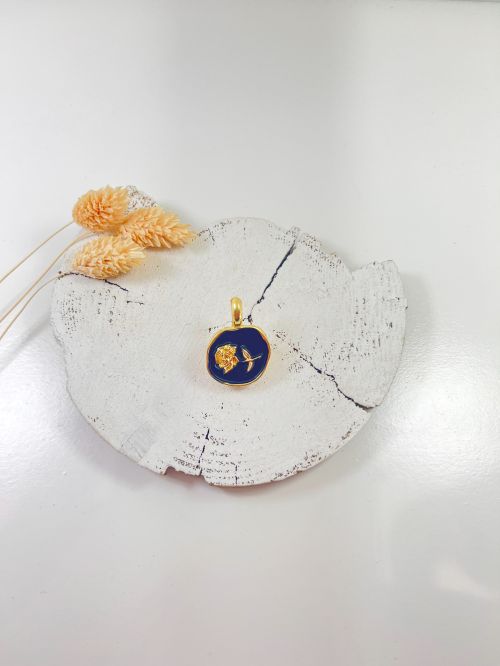 Broche pinza negro flor dorada