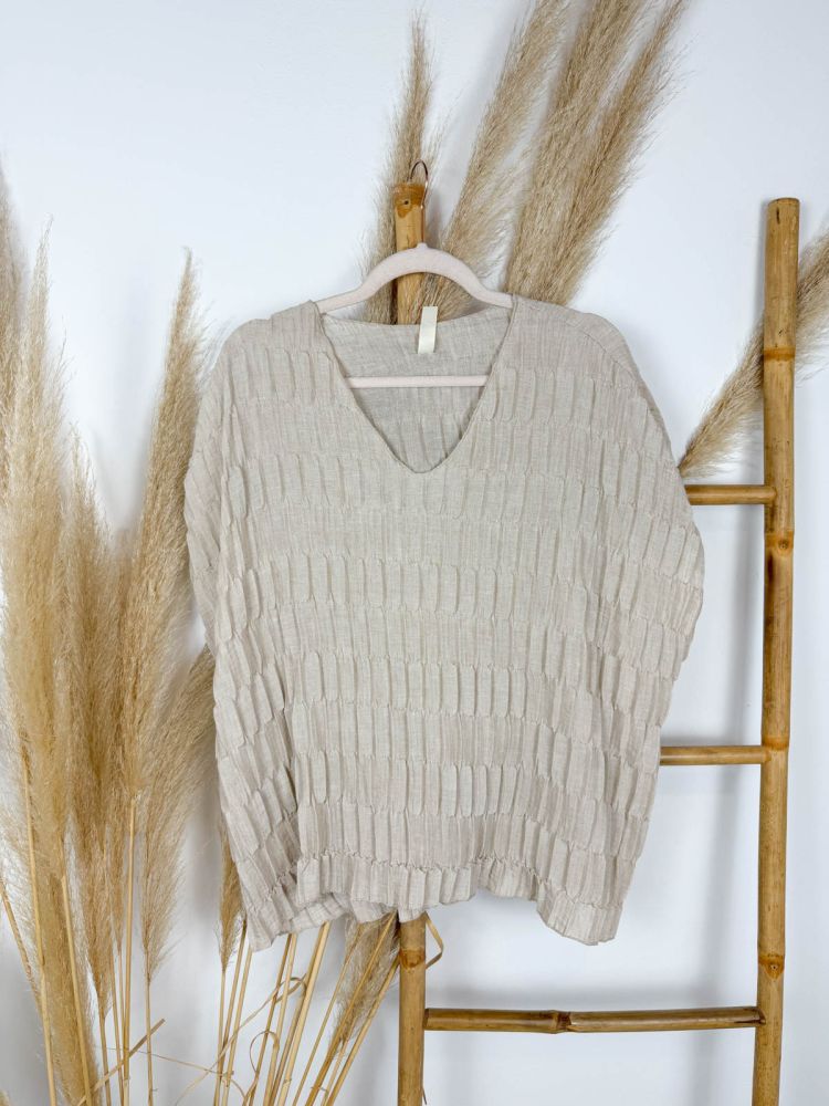 Blusa beige de lino con texturas