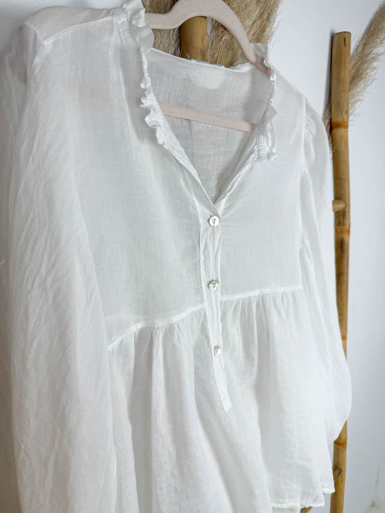 Blusa blanca mangas murciélago mini...