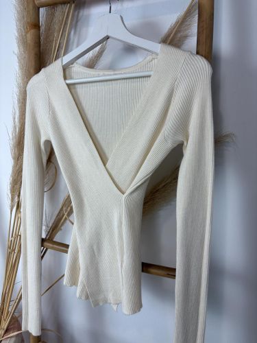 Chaleco beige de canalé en pico