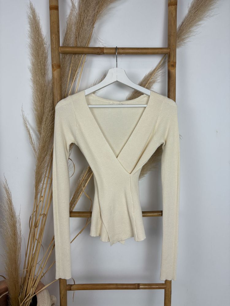 Chaleco beige de canalé en pico